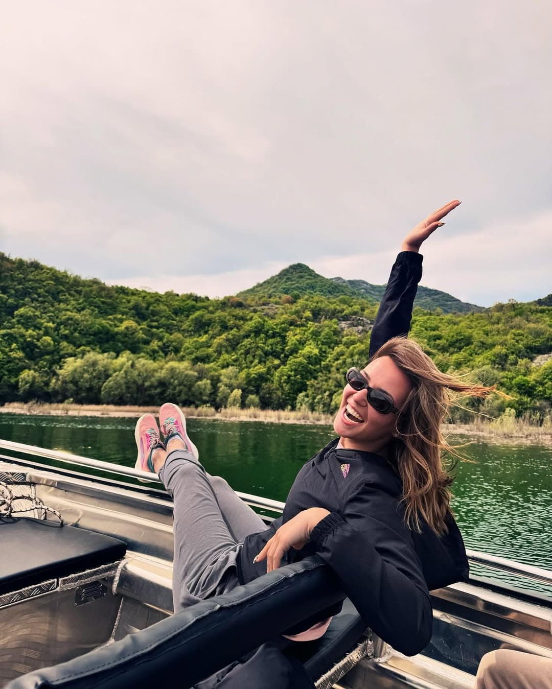Guest enjoying boat tour on Skadar Lake